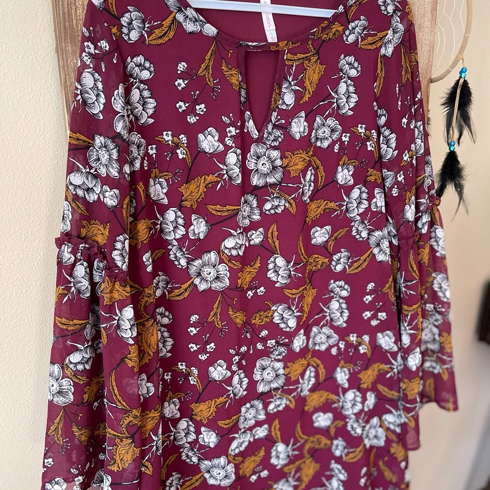 Floral print dress with bell sleeves.